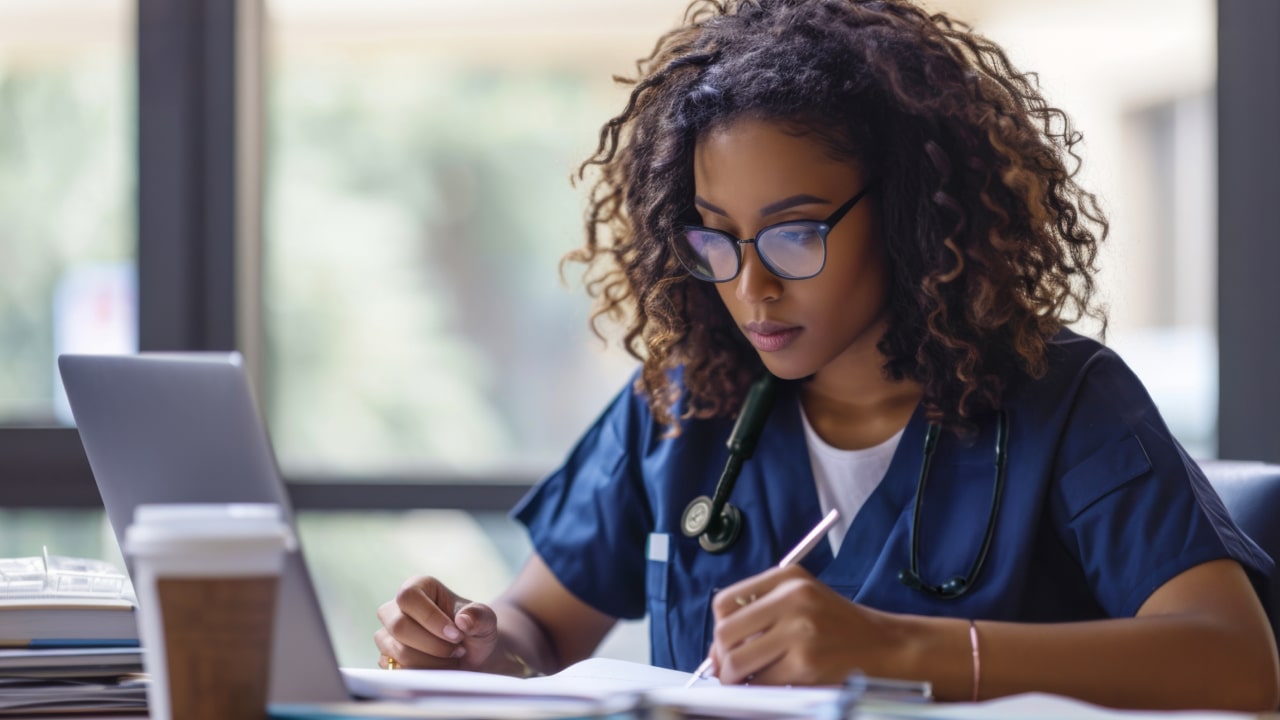 Medical student studies in front of computer
